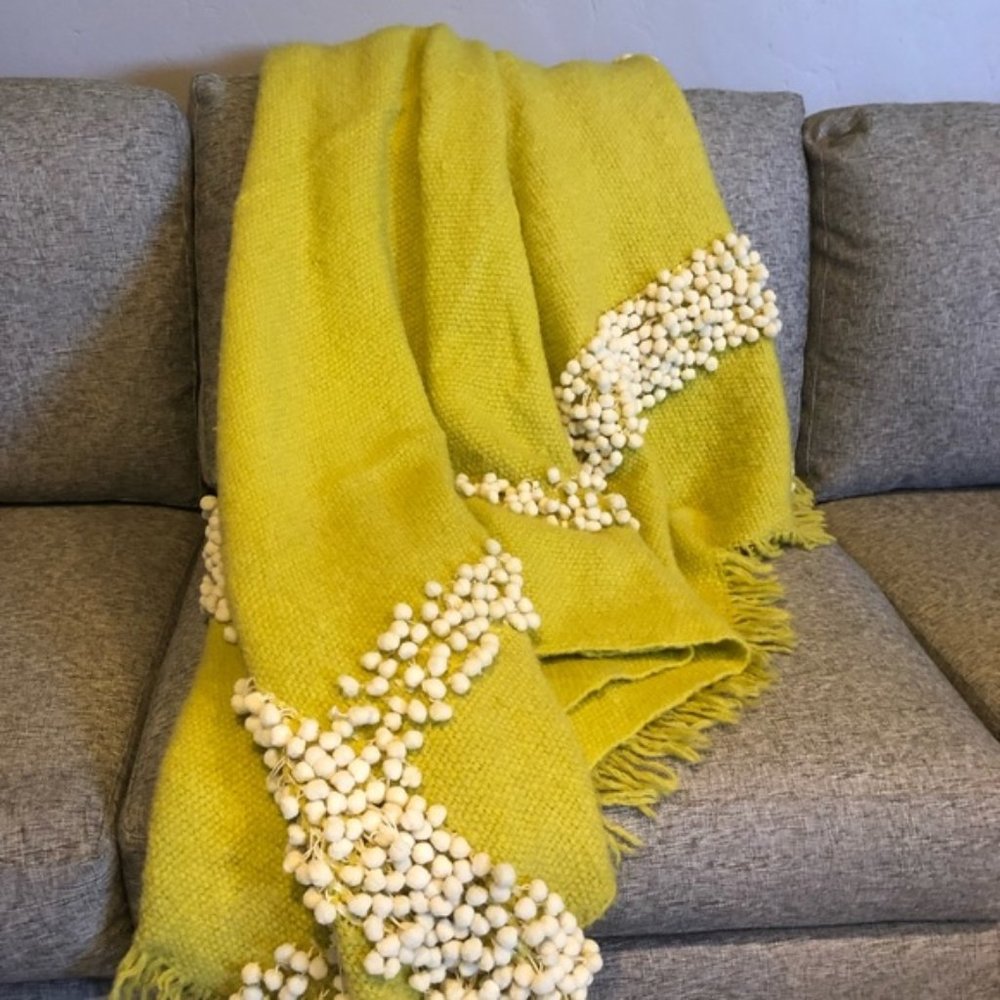 anthropologie pom pom throw